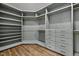 Large walk-in closet with ample shelving at 5121 Watkinsdale Ave, Raleigh, NC 27613