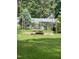 Backyard with picnic table and string lights at 7253 Hunt Valley Trl, Wendell, NC 27591