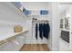 Bright walk-in closet with ample shelving and hanging space at 13541 Old Creedmoor Rd, Wake Forest, NC 27587