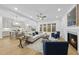 Open living area with hardwood floors, fireplace, and a view into the kitchen at 13541 Old Creedmoor Rd, Wake Forest, NC 27587