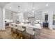 Spacious kitchen with light gray cabinets, white quartz countertops, and gold accents at 13541 Old Creedmoor Rd, Wake Forest, NC 27587