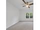 Spacious bedroom with ceiling fan and large window, carpeted floors at 13541 Old Creedmoor Rd, Wake Forest, NC 27587