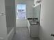 Double vanity bathroom with dark countertop and tile floor at 1189 Barreto Dr, Wendell, NC 27591