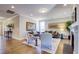 Open living room with hardwood floors and a view into the hallway and kitchen at 3102 Castlerock Dr # 2, Burlington, NC 27215