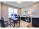 Bright home office features a large window, desk, and comfortable seating at 3102 Castlerock Dr # 2, Burlington, NC 27215
