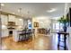 Open floor plan with kitchen island, dining area, and hardwood floors at 3102 Castlerock Dr # 2, Burlington, NC 27215