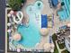 Relaxing pool area with a waterslide and plenty of lounge chairs at 3102 Castlerock Dr # 2, Burlington, NC 27215