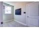 Convenient laundry room with a window, tile flooring, and a hanging rack at 3102 Castlerock Dr # 2, Burlington, NC 27215