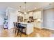 Modern kitchen with white cabinets, granite island, and stainless steel appliances at 3102 Castlerock Dr # 2, Burlington, NC 27215