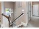 Upstairs hallway with wood railing and carpet at 6920 Will Let Ln, Wake Forest, NC 27587