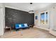 Cozy sitting room featuring a dark brick accent wall at 6920 Will Let Ln, Wake Forest, NC 27587