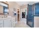 Modern bathroom with blue tile shower and double vanity at 6920 Will Let Ln, Wake Forest, NC 27587