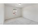 Well-lit bedroom featuring neutral carpet at 1427 Goldsboro Ave, Sanford, NC 27330