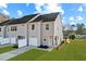 Two story townhome with gray siding and garage at 1427 Goldsboro Ave, Sanford, NC 27330