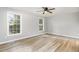 Spacious bedroom with light gray walls and wood-look flooring at 2912 Omah St, Durham, NC 27705