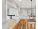 Open hallway with wood floors and a view of an office at 503 Damascus Church Rd, Chapel Hill, NC 27516