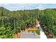 Aerial view showcasing a home nestled in a wooded lot at 503 Damascus Church Rd, Chapel Hill, NC 27516