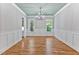 Formal dining room with hardwood floors, wainscoting, and a chandelier at 503 Damascus Church Rd, Chapel Hill, NC 27516