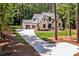 Aerial view showcasing the house, driveway, and surrounding trees at 503 Damascus Church Rd, Chapel Hill, NC 27516