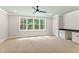 Spacious bedroom with large windows, carpet, and a ceiling fan at 503 Damascus Church Rd, Chapel Hill, NC 27516