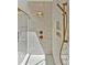 Modern shower with herringbone tile and gold fixtures at 503 Damascus Church Rd, Chapel Hill, NC 27516