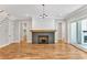 Fireplace, hardwood floors and access to the backyard are featured in this room at 503 Damascus Church Rd, Chapel Hill, NC 27516