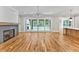 Spacious living area with hardwood floors, fireplace and sliding glass doors at 503 Damascus Church Rd, Chapel Hill, NC 27516