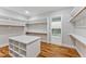 Spacious walk-in closet with custom shelving, hanging space and laundry access at 503 Damascus Church Rd, Chapel Hill, NC 27516
