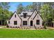 Stunning two-story house with white brick and black windows at 503 Damascus Church Rd, Chapel Hill, NC 27516