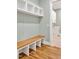 Functional mudroom with built-in bench, cubbies, and hardwood floors at 503 Damascus Church Rd, Chapel Hill, NC 27516