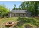 Large backyard with fire pit and patio area at 119 Running Bear Dr, Louisburg, NC 27549