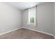 Well-lit bedroom with neutral walls and carpeting at 119 Running Bear Dr, Louisburg, NC 27549