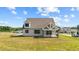 Gray house with a covered porch and a large backyard at 4566 Ashtons Way, Franklinton, NC 27525