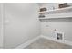 Laundry room with shelving and tiled floor at 4566 Ashtons Way, Franklinton, NC 27525