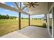 Covered patio with ceiling fan and backyard view at 4566 Ashtons Way, Franklinton, NC 27525