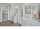 Bathroom with double vanity, walk-in shower, and a large closet at 4566 Ashtons Way, Franklinton, NC 27525