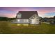Two-story house with gray siding and a covered patio at 4566 Ashtons Way, Franklinton, NC 27525