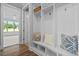 White cubbies with bench and pillows, near an open room at 4566 Ashtons Way, Franklinton, NC 27525