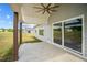 Covered patio with sliding glass doors and backyard view at 4566 Ashtons Way, Franklinton, NC 27525
