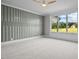 Bedroom with large window, accent wall, and carpet flooring at 4566 Ashtons Way, Franklinton, NC 27525