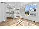 Kitchen with island, white cabinets, and large windows at 4566 Ashtons Way, Franklinton, NC 27525