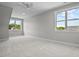 Spacious bedroom with large windows and plush carpeting at 4566 Ashtons Way, Franklinton, NC 27525