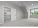 Bright bedroom with a walk-in closet and ceiling fan at 4566 Ashtons Way, Franklinton, NC 27525