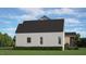 Exterior view of a two-story home with a gable roof and light colored siding at 50 Hidden Lake Dr, Franklinton, NC 27525