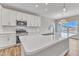 Island kitchen with white cabinets and quartz countertops at 30 Barham Mill Pond Ln, Wendell, NC 27591