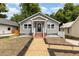 Gray house with brick pathway, solar lights, and landscaping at 621 Church St, Raleigh, NC 27601