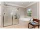 Spa-like bathroom featuring a large shower and garden tub at 1329 Endgame Ct, Wake Forest, NC 27587
