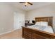 Bright bedroom with double doors and wood bed frame at 1329 Endgame Ct, Wake Forest, NC 27587