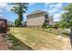 Landscaped backyard with privacy fence and mature trees at 1329 Endgame Ct, Wake Forest, NC 27587