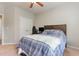 Well-lit bedroom with double bed, built-in closet and hardwood floors at 1329 Endgame Ct, Wake Forest, NC 27587